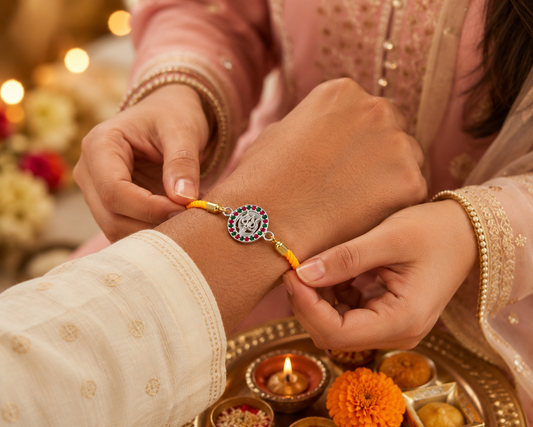 Silver Trishul Rakhi with Ruby & Emerald Stones