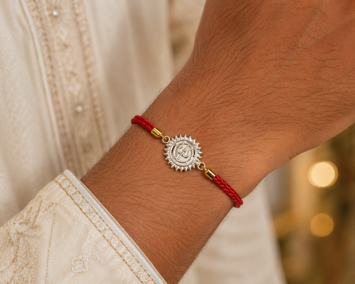 Red Braided Rakhi with Sunburst Medallion